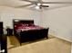 Bedroom featuring a ceiling fan, natural light, and neutral carpeting for comfort at 4853 Sw 53Rd Rd, Ocala, FL 34474