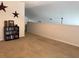 Spacious bonus room with plush carpeting and minimalist decor, perfect for relaxing or entertaining at 4853 Sw 53Rd Rd, Ocala, FL 34474
