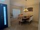 Inviting dining room illuminated by a classic chandelier, with a view of the entry at 4853 Sw 53Rd Rd, Ocala, FL 34474