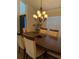 Formal dining area featuring natural light, wood furniture, and a chandelier at 4853 Sw 53Rd Rd, Ocala, FL 34474