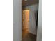 Hallway with an open doorway and light neutral color walls at 4853 Sw 53Rd Rd, Ocala, FL 34474