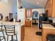 Open kitchen with breakfast bar, lots of cabinets, and view to dining area at 4853 Sw 53Rd Rd, Ocala, FL 34474