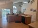 Kitchen featuring island with seating and stainless steel dishwasher at 4853 Sw 53Rd Rd, Ocala, FL 34474