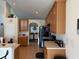 Open kitchen with wood cabinetry, breakfast bar and tile flooring at 4853 Sw 53Rd Rd, Ocala, FL 34474