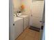 This spacious laundry room is equipped with a modern washer, dryer and ample storage at 4853 Sw 53Rd Rd, Ocala, FL 34474