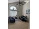 Living room features a high ceiling, arched window, and comfortable furnishings at 4853 Sw 53Rd Rd, Ocala, FL 34474