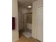 Bathroom featuring a glass shower enclosure, a towel rack, and tile flooring at 4853 Sw 53Rd Rd, Ocala, FL 34474