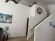 Bright staircase with a world map and a large clock at 4853 Sw 53Rd Rd, Ocala, FL 34474