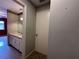A bathroom is located off the hall, equipped with a vanity and sink at 5024 Se 109Th St, Belleview, FL 34420