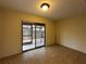 Bedroom features sliding door to a screened patio, inviting the outdoors in at 5024 Se 109Th St, Belleview, FL 34420