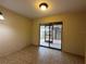 Bright bedroom with sliding door to a screened patio allowing ample natural light at 5024 Se 109Th St, Belleview, FL 34420