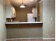 Charming kitchen with breakfast bar, white cabinets, and functional layout at 5024 Se 109Th St, Belleview, FL 34420