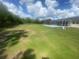 Large backyard showing the expansive green lawn leading up to the screened-in pool area at 5323 Sw 111Th Lane Rd, Ocala, FL 34476