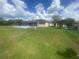 Expansive backyard featuring a screened-in pool area and a lush green lawn at 5323 Sw 111Th Lane Rd, Ocala, FL 34476