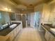 Bright bathroom with dual vanities and separate shower stall and toilet room at 5323 Sw 111Th Lane Rd, Ocala, FL 34476