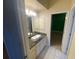 Bathroom featuring granite countertop, vessel sink, vanity, and a neutral tile floor at 5323 Sw 111Th Lane Rd, Ocala, FL 34476