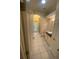 Bathroom with granite counters, tile floors, a walk-in shower and toilet at 5323 Sw 111Th Lane Rd, Ocala, FL 34476