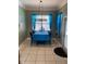 Charming dining room with bright blue table cloth and matching curtains at 5323 Sw 111Th Lane Rd, Ocala, FL 34476
