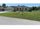 Beautiful home with a well manicured front lawn and three car garage at 5323 Sw 111Th Lane Rd, Ocala, FL 34476