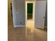 Hallway featuring neutral walls, tile floors, and access to other rooms within the home at 5323 Sw 111Th Lane Rd, Ocala, FL 34476