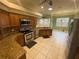 Spacious kitchen featuring stainless steel appliances, granite counters, and breakfast nook at 5323 Sw 111Th Lane Rd, Ocala, FL 34476