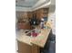 Traditional kitchen featuring stainless steel appliances, brown cabinets, and granite countertops with a breakfast bar at 5323 Sw 111Th Lane Rd, Ocala, FL 34476