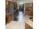 A spacious kitchen features stainless steel appliances, tile floors, and granite countertops at 5323 Sw 111Th Lane Rd, Ocala, FL 34476