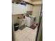 Bright laundry room featuring a washer and dryer, and overhead cabinets for storage at 5323 Sw 111Th Lane Rd, Ocala, FL 34476