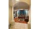 Open living space with columns, wood floors, and decorative accents at 5323 Sw 111Th Lane Rd, Ocala, FL 34476