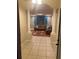 Inviting living room featuring tile entry, columns and decorative drapery at 5323 Sw 111Th Lane Rd, Ocala, FL 34476