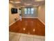 Open-concept living room features hardwood floors, modern fixtures, and natural light at 5323 Sw 111Th Lane Rd, Ocala, FL 34476