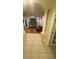 Inviting living room featuring stylish columns, coffered ceilings, and hardwood floors at 5323 Sw 111Th Lane Rd, Ocala, FL 34476