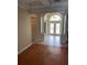 Bright living room featuring hardwood floors, coffered ceilings, and grand entrance at 5323 Sw 111Th Lane Rd, Ocala, FL 34476