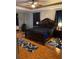 The main bedroom features a ceiling fan, tray ceiling, and decorative rug accents at 5323 Sw 111Th Lane Rd, Ocala, FL 34476