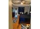 Bright main bedroom featuring a ceiling fan, a large window and wood-style flooring at 5323 Sw 111Th Lane Rd, Ocala, FL 34476