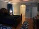 The main bedroom features a ceiling fan, dark wood furniture, and natural light at 5323 Sw 111Th Lane Rd, Ocala, FL 34476