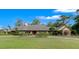 Expansive front yard showcases this home's architectural details and manicured landscaping, offering great curb appeal at 5950 Sw 21St Avenue Rd, Ocala, FL 34471