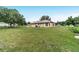 Expansive backyard with lush grass, offering plenty of space for outdoor activities and relaxation at 6701 Nw 6Th Ave, Ocala, FL 34475