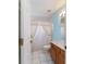Charming bathroom featuring tiled floors, single sink vanity, and shower at 6701 Nw 6Th Ave, Ocala, FL 34475