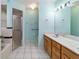 Bathroom featuring tiled floor, single sink vanity and shower at 6701 Nw 6Th Ave, Ocala, FL 34475
