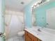 Bathroom featuring a single sink vanity, tiled floors and a shower with tub at 6701 Nw 6Th Ave, Ocala, FL 34475