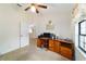 Cozy bedroom with ceiling fan, desk setup and ample natural light at 6701 Nw 6Th Ave, Ocala, FL 34475