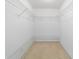 Walk-in closet featuring carpet and custom wire shelving at 6701 Nw 6Th Ave, Ocala, FL 34475