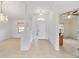 Bright foyer with tiled floor, leading to multiple rooms and featuring a decorative chandelier at 6701 Nw 6Th Ave, Ocala, FL 34475