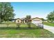 Charming single-story home with a well-manicured front yard and an attached two-car garage at 6701 Nw 6Th Ave, Ocala, FL 34475