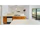 Kitchen with an island, breakfast bar, and wooden cabinets at 6701 Nw 6Th Ave, Ocala, FL 34475