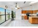 Kitchen with a view, wooden cabinets, and a tiled floor at 6701 Nw 6Th Ave, Ocala, FL 34475