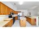 Updated kitchen featuring an island, stainless steel appliances, and wood cabinetry at 6701 Nw 6Th Ave, Ocala, FL 34475