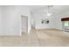 Open living space featuring neutral tile and carpet, ceiling fan and lots of natural light at 6701 Nw 6Th Ave, Ocala, FL 34475