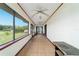 Inviting screened porch features tile floors and ceiling fans for comfortable outdoor living at 6701 Nw 6Th Ave, Ocala, FL 34475